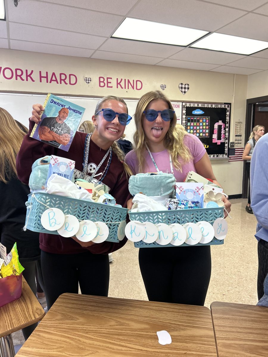 Freshmen Bella Branson(left) and Kinsley Humphrey(right) pose with their baskets gifted to them by their Anchor Bigs. 