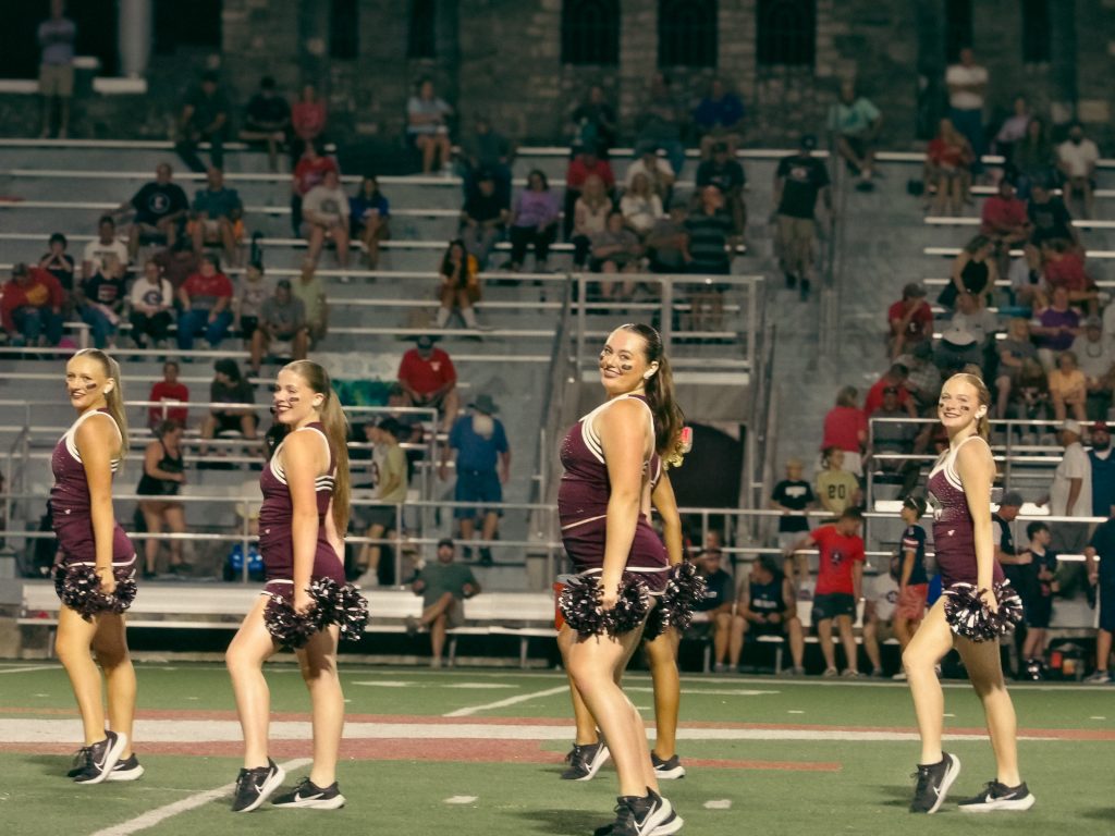 Members of the Viking Dance team hold their last pose after their performance at the first home football game of the season.