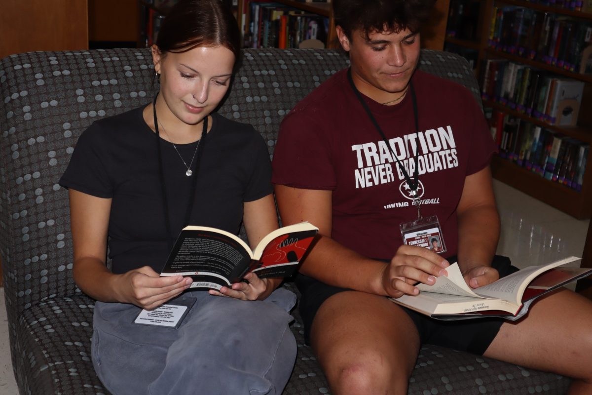 Book Club leader, Arabella Taylor, and member, Killian Laoo, enjoying the joys of reading together.