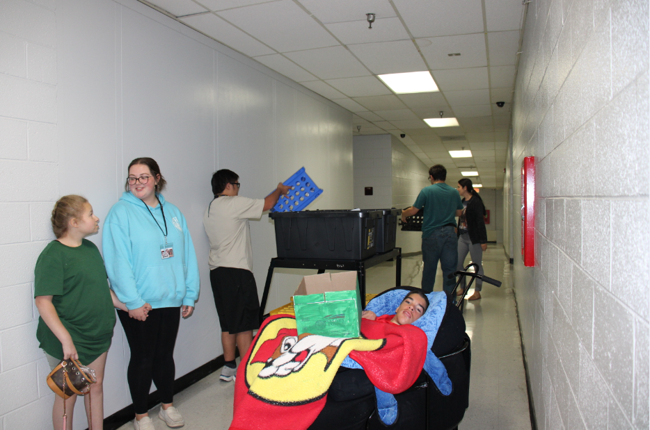 Students involved in the recycling program go around the halls collecting paper, plastic, and cardboard. 