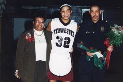 Before she was the youngest inductee in the BTCS Athletic Hall of Fame, Courtney McDaniel, who graduated in 2000, held multiple records for basketball. She is pictured here standing beside her supporters. (Courtesy of Courtney McDaniel)