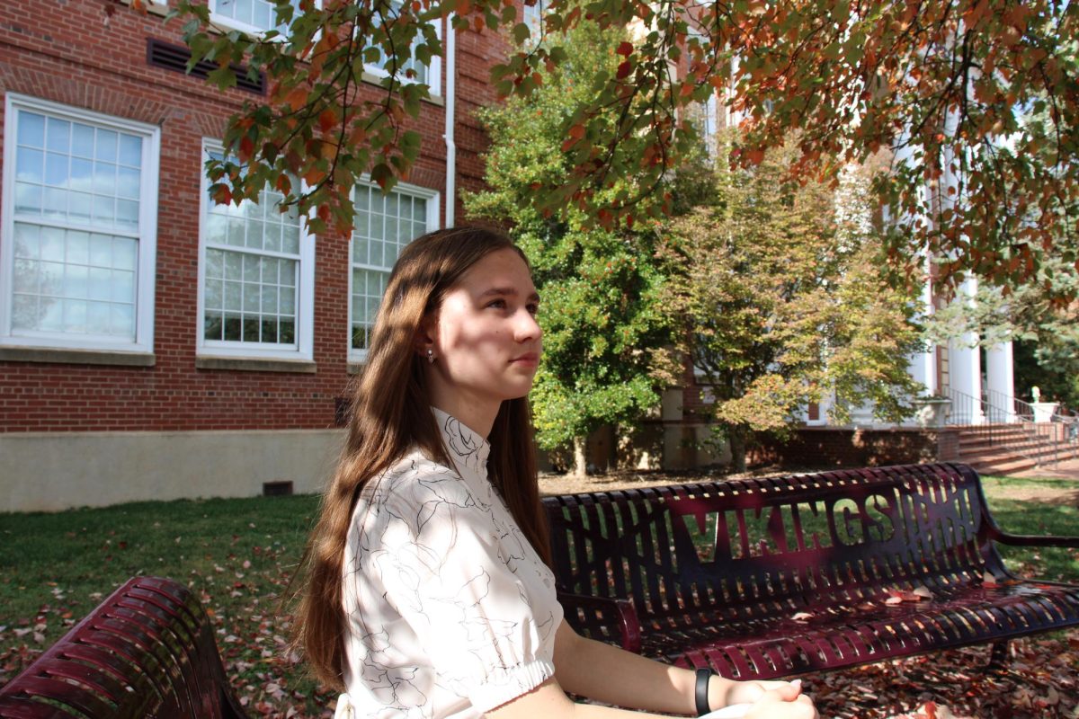 Sophomore Alisa Moha sits on a bench in front of Tennessee High in Bristol, Tennessee, and reflects on her homeland of the Ukraine.  Her poem, "In the Soul of Wheat and Freedom," reflects her pride as a Ukrainian and her desire to bring hope to her fellow Ukrainians around the world.