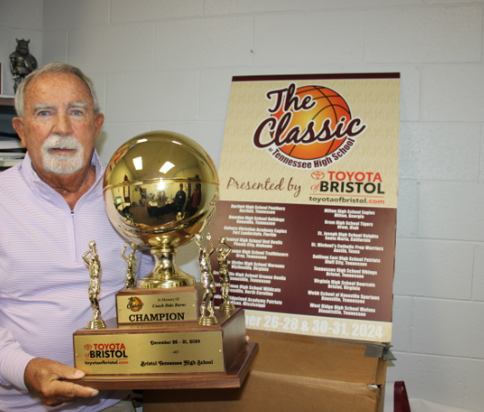 Director of the upcoming "The Classic" tournament, Richard Ensor, stands with the trophy for the champion of the tournament. 