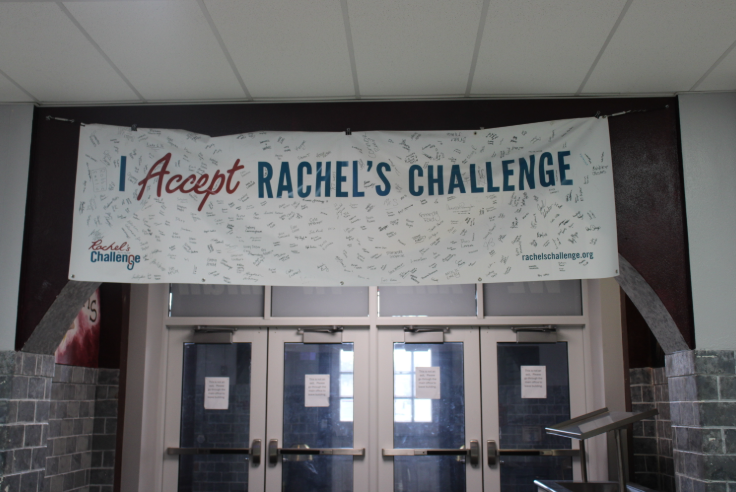 Rachel's Challenge banner with student signatures, hanging in the main hallway.