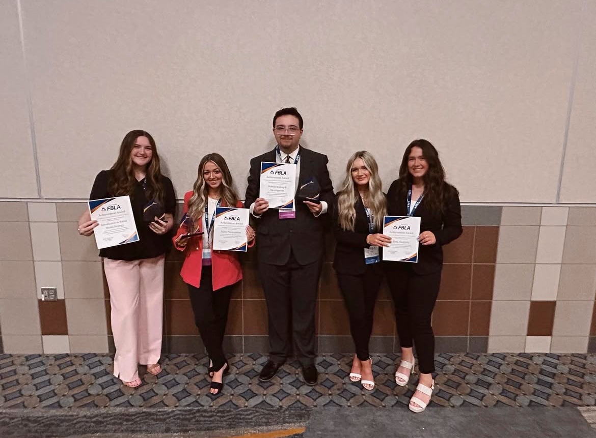 Averie Cuddy, Mackenzie Addison, Kedrick Gilliam, Karrie English, and Ragan Joyner at their state conference last year.