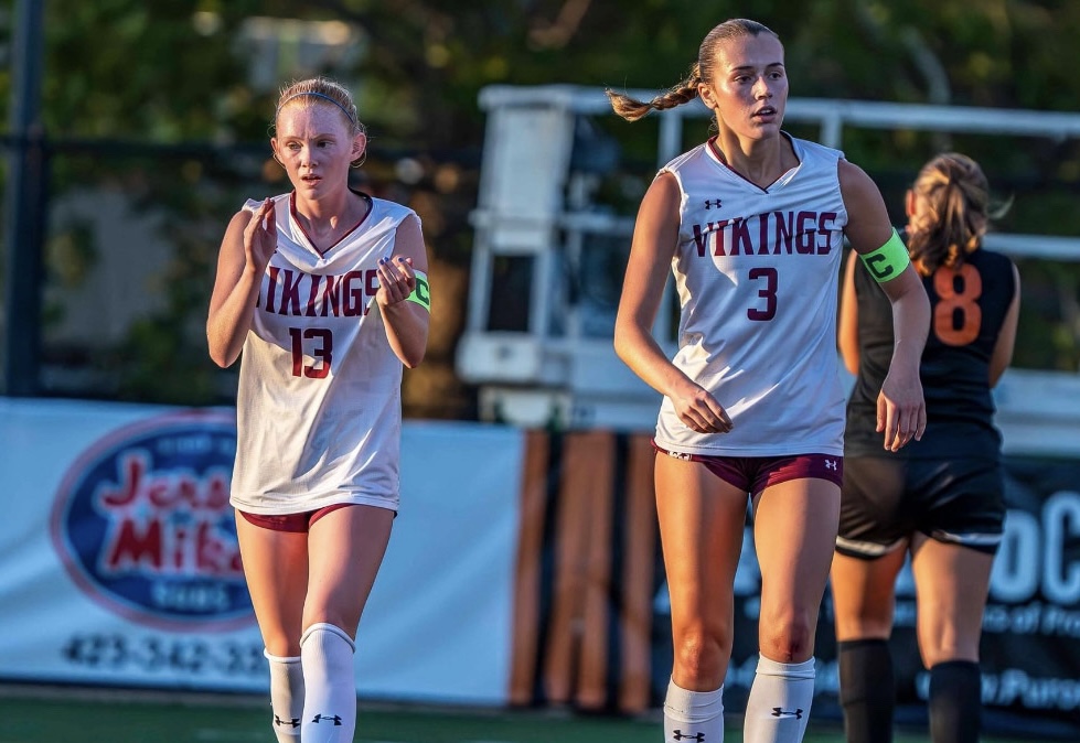 Co-captain midfielder Lana Lavinder, 13,  and co-captain forward Aryana Patterson, 3, leading the team. (Photo courtesy Danny Dorsey)