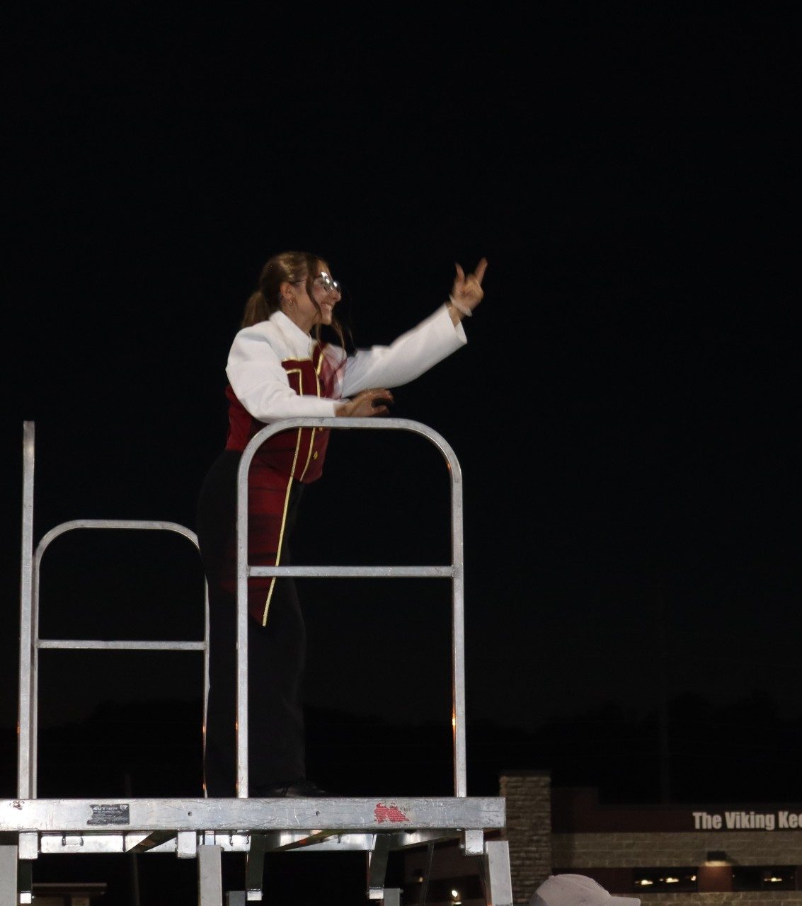 Drum Major Kaydin Quales relishes in the triumph of the band performance.  