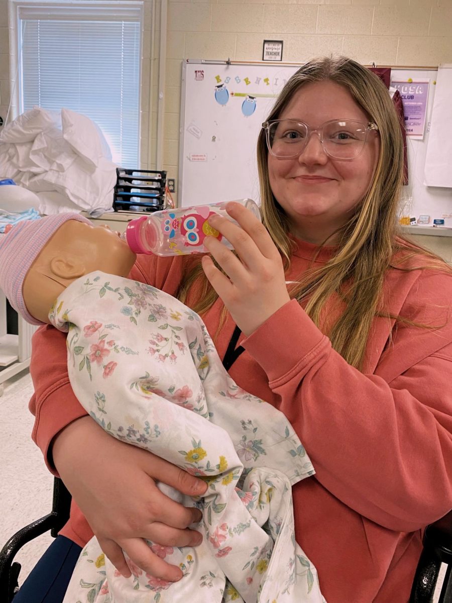 Emma Gilbert Practicing her skills as a nurse. 