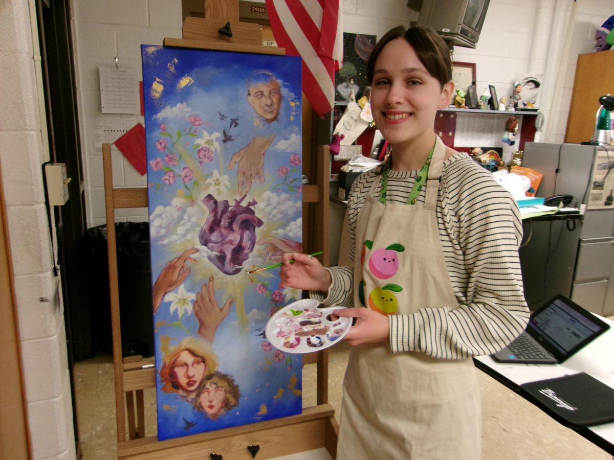 Senior Margaux Trombetta working on a piece in AP Art