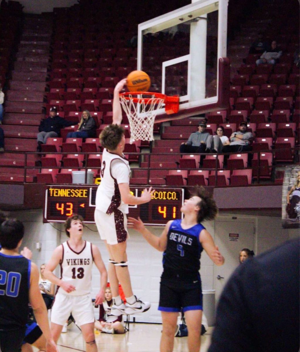 Colin Brown dunks against the Greenville Devils, bringing the score up. This fall, Brown will play basketball for Carson-Newman.
