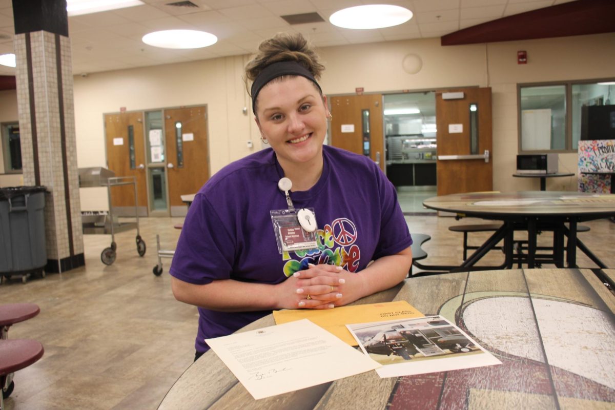 Caitlin Adams with her letter, photo, and envelope from President George W. Bush.