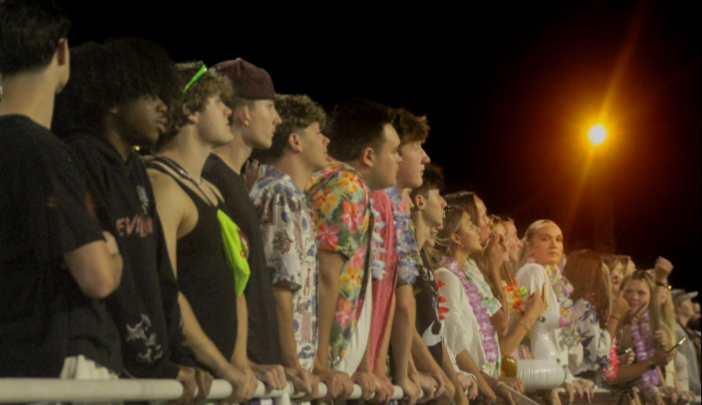 Senior student overlooking the first home game of the season. 