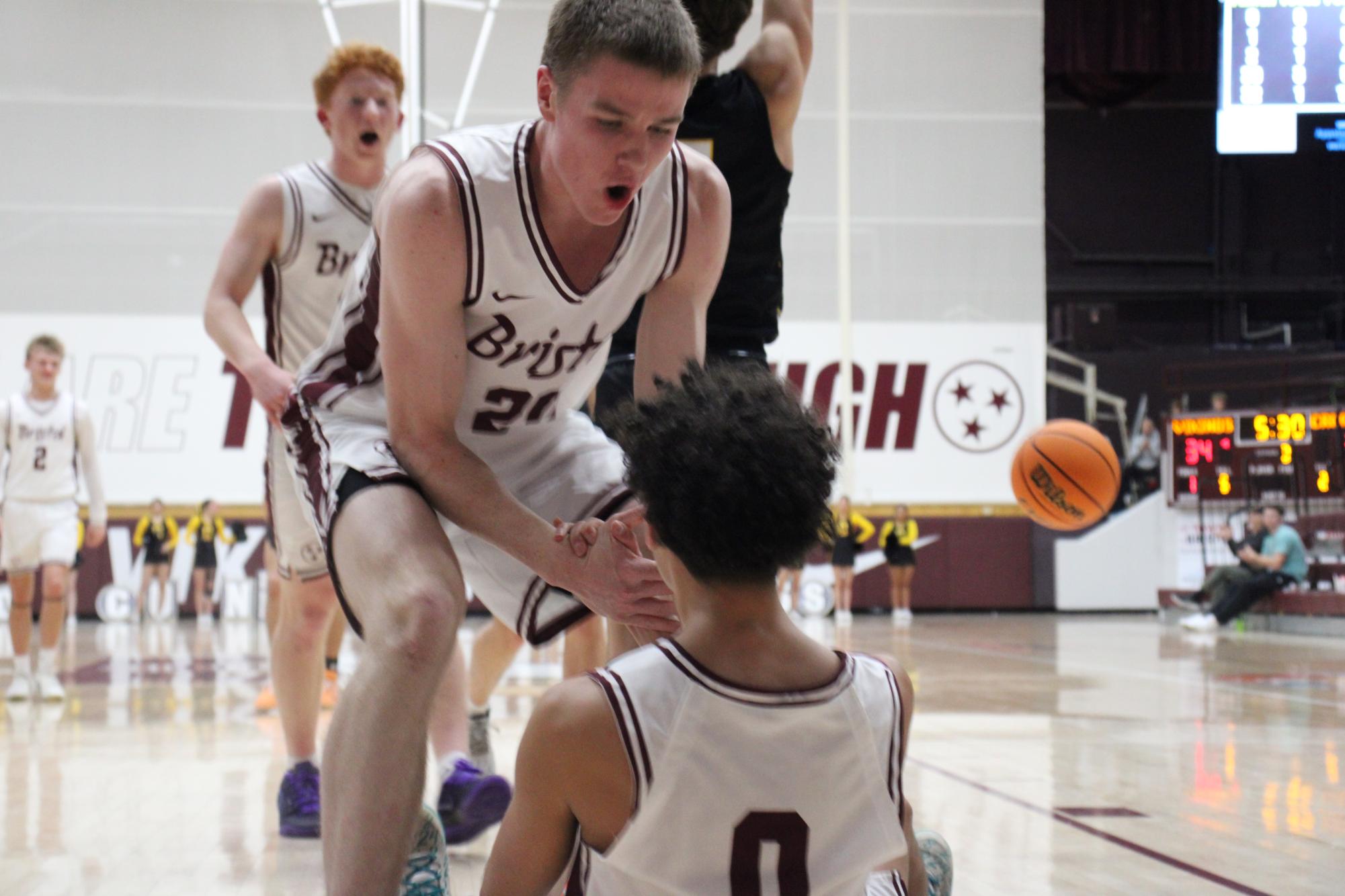 Senior Reed Miller pulls Senior Braden Howard off the ground after getting fouled and making the shot.