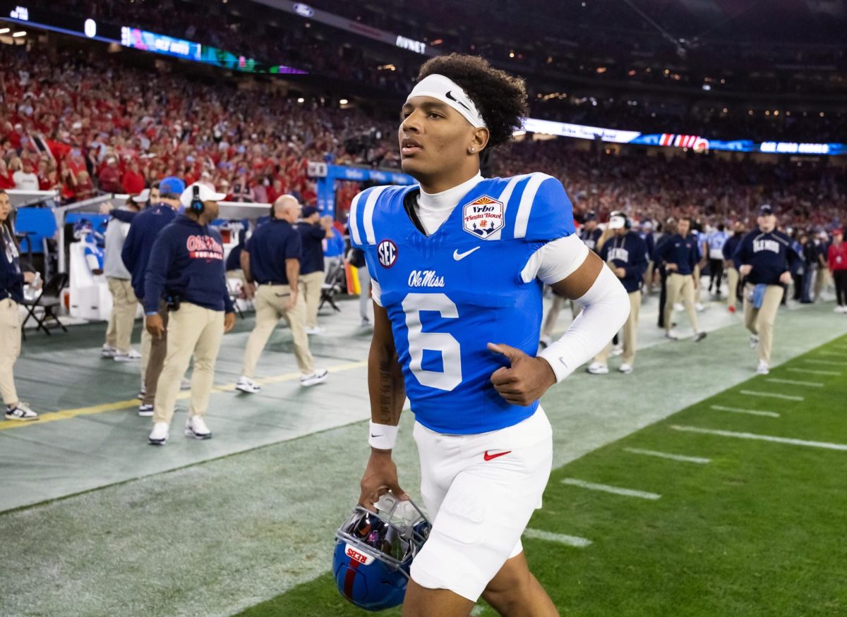 Jan 8, 2026; Glendale, AZ, USA; Mississippi Rebels quarterback Trinidad Chambliss (6) against the Miami Hurricanes during the 2026 Fiesta Bowl and semifinal game of the College Football Playoff at State Farm Stadium. Mandatory Credit: Mark J. Rebilas-Imagn Images