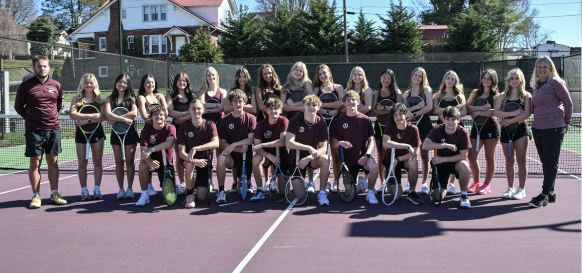 The boys and girls tennis teams line up for media day as a collective team.