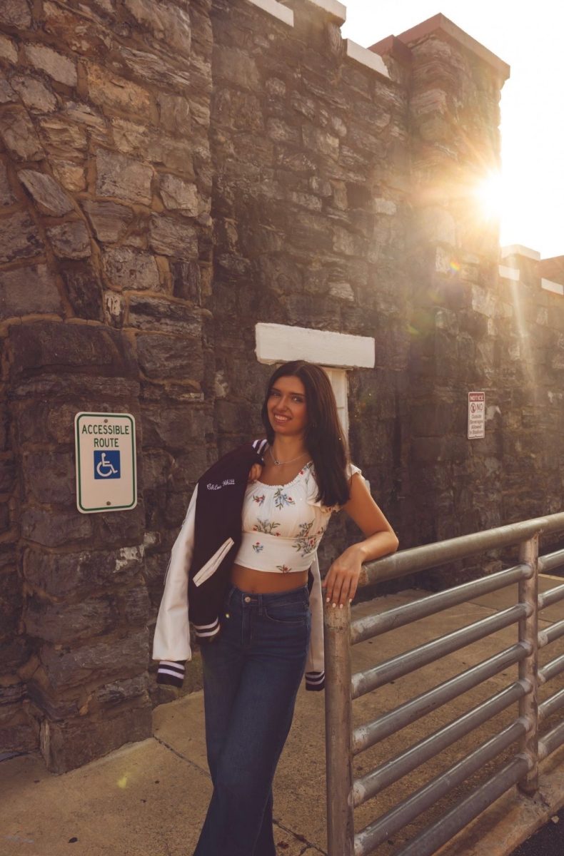 Photo of future UTK student, Chloe Whitt, standing outside of the Stone Castle.
