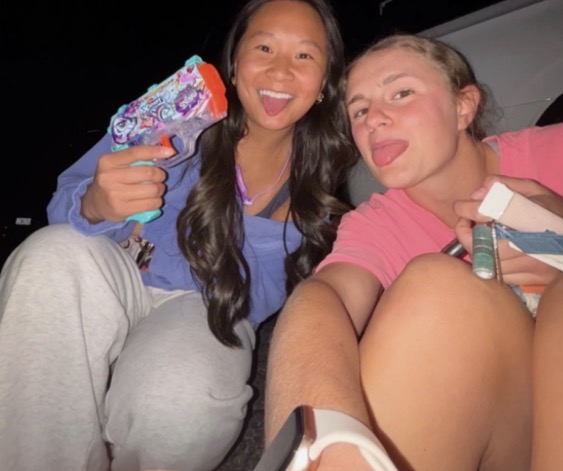 Lucy Millwood [left] and Sophia Streetman [right] with water guns in hand, getting prepared to eliminate their target(s).